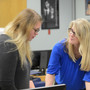 Western Nevada College Photo #1 - Western Nevada College Graphic Communications professor Jayna Conkey (left) helps a student.